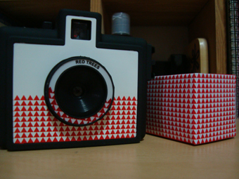 The camera comes with a roll of film in a matching box